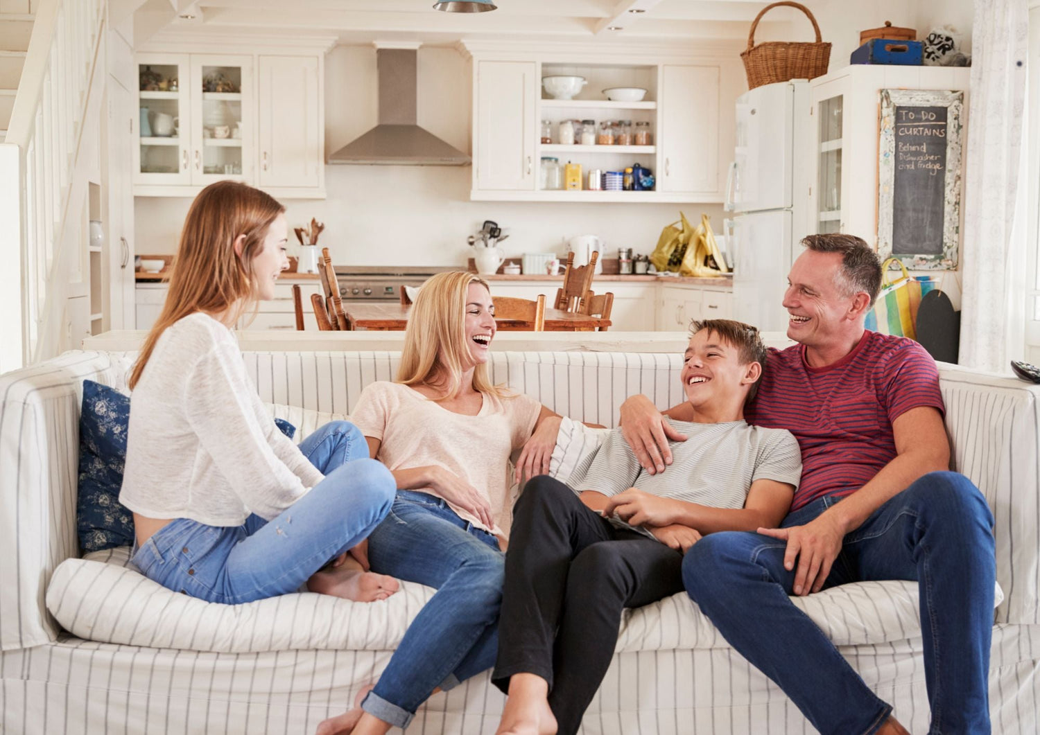 A parent and grandparent having a positive, smiling conversation about family gift-giving